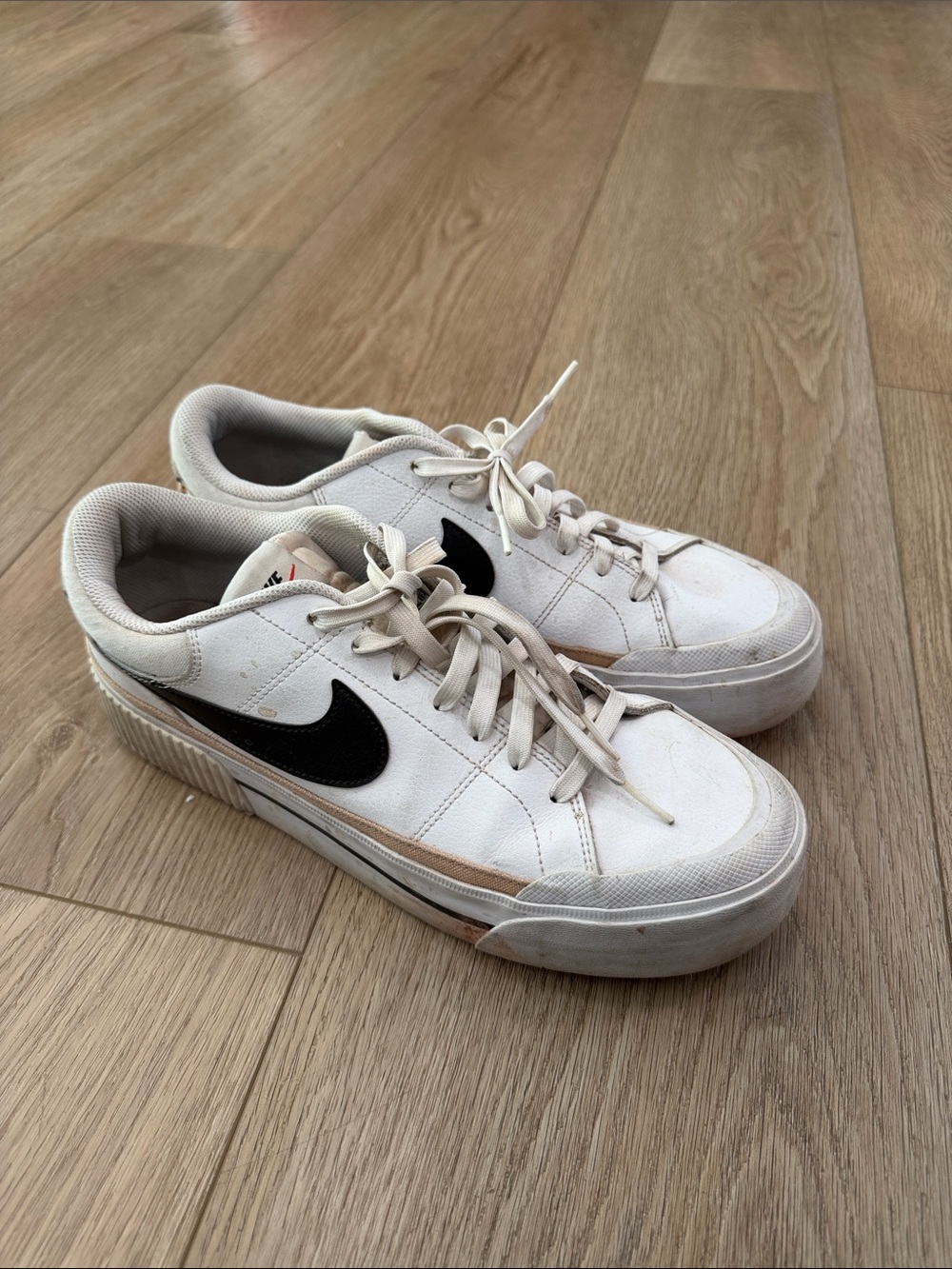 Nike Men’s White Sneakers with Black Swoosh and Tan Accent